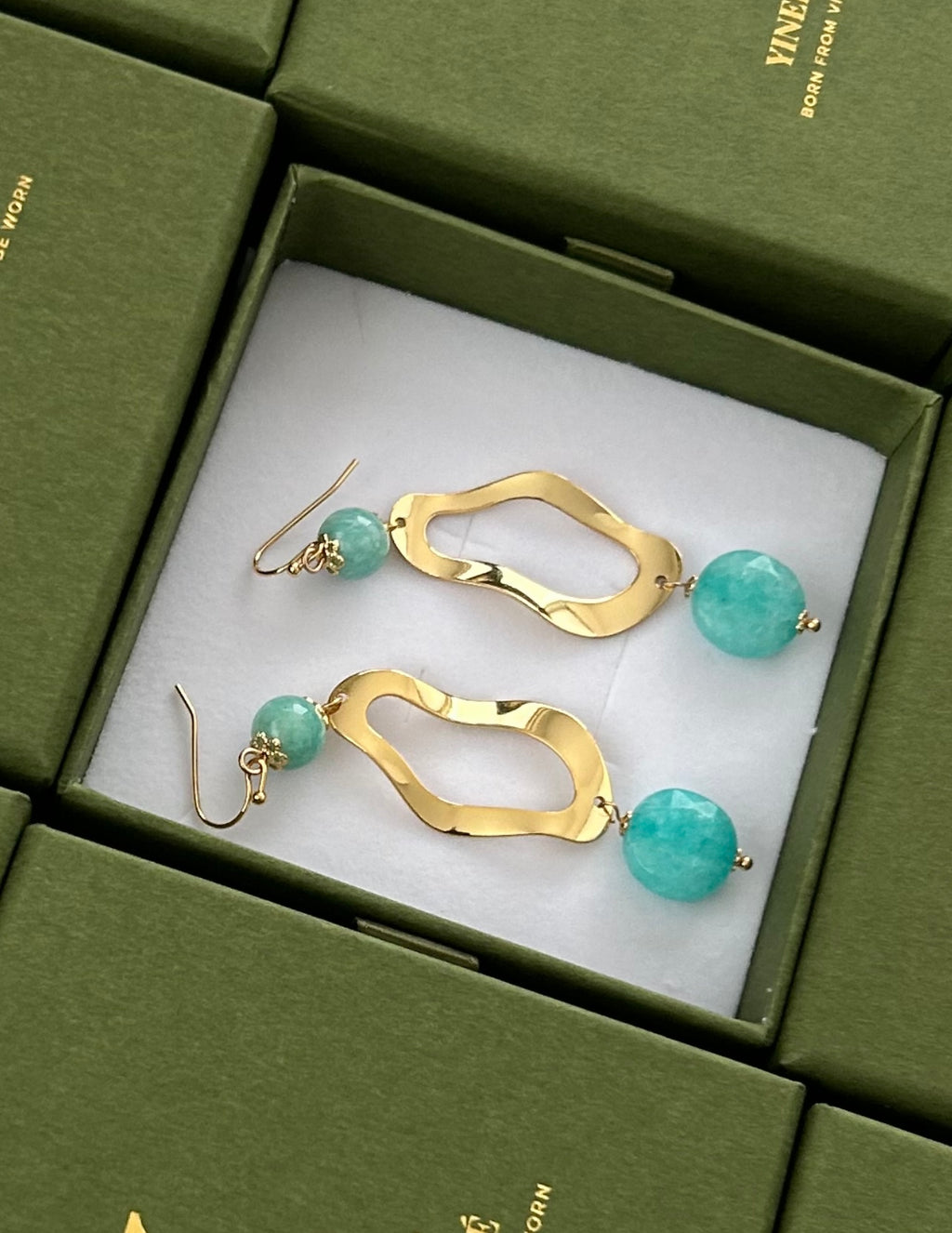 Gold curve earrings
